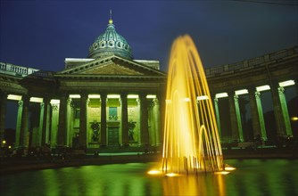 RUSSIA, St. Petersburg, "Kazan Cathedral, exterior facade and fountain in foreground illuminated at