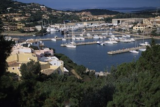 ITALY, Sardinia, Costa Smeralda, Porto Cervo harbour. View down over buildings and harbour with
