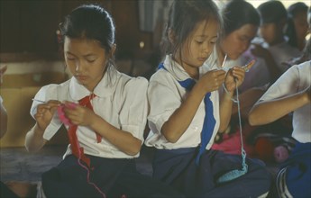 LAOS, Children, School, Crocheting class at rural girls school.