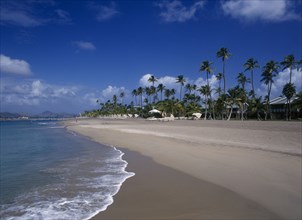 WEST INDIES, Nevis, Pinneys Beach, Four Seasons Resort.  Quiet sandy beach at the waters edge.
