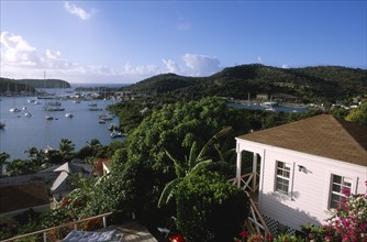 WEST INDIES, Antigua, English Harbour, Ordnance Bay.  View over bay with moored yachts and tree