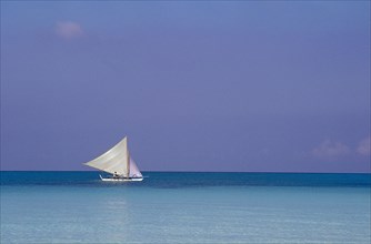 PHILIPPINES, Boracay, Sailboat offshore in clear water