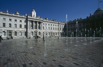 ENGLAND, London, Somerset House and courtyard with rows of fountains spouting high from the ground