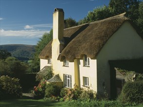 ENGLAND, Somerset, Selworthy, Thatched cottage with mullioned windows.
