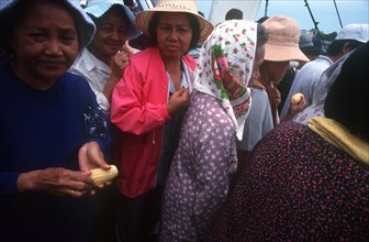 VIETNAM, Mekong Delta, Can Tho, "Crowd of passengers on board a ferry, close cropped view."