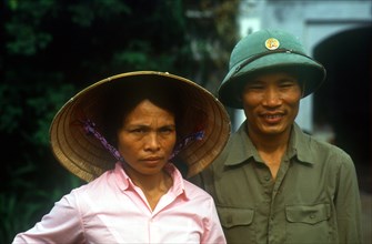VIETNAM, North, Hanoi, "Wedding couple with the man in military uniform, by the Petit Lac."