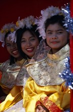 THAILAND, North, Chiang Mai, Chinese new Year procession three smiling girls on float