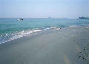 THAILAND, Trat Province, Koh Chang, "Lonley Beach, Aow Bai Lan. Fishing boat seen at anchor off the
