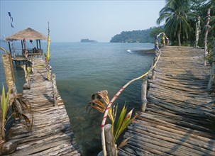THAILAND, Trat Province, Koh Chang, "Lonley Beach, Aow Bai Lan. Bridge leading to a wooden platform
