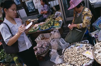 THAILAND, North, Chiang Mai, Wholesale Food Market.  Female buyer for restaurant purchasing