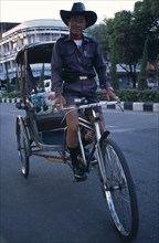 THAILAND, North, Chiang Mai, Cyclo driver on his bike.