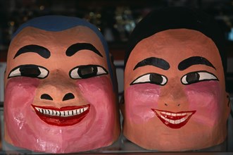 THAILAND, North, Chiang Mai, Chinese New Year.  Close view of two character masks worn during