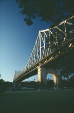 AUSTRALIA, Queensland, Brisbane, Angled view of Storey Bridge at sunset.