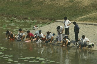 CHINA, People , Washing, Near the China plain. People washing their clothes in the river.