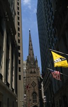 USA, New York, New York City, Trinity Church seen through Wall Street