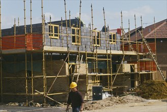 ARCHITECTURE, Construction, Building Site, Scaffolding surrounding half completed brick house with