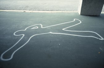 USA, Florida, Painted outline of murder victim on sidewalk pavement
