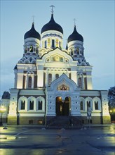 ESTONIA, Tallinn, Alexander Nevsky Cathedral facade illuminated at dusk.