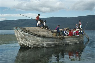 CHINA, Yunnan, Dali, Old junk carrying people on lake Er also known as Er Hai