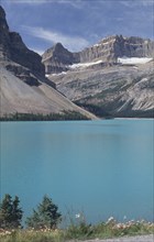 CANADA, British Columbia, Jasper National Park, View over mountain lake toward rocky cliffs