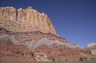 USA, Utah, Capitol Reef National Park. Towering ochre and white and red rock walls displaying