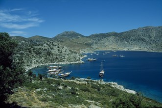 TURKEY, Agean Coast, Marmaris, View over Loryma Bay with moored boats surrounded by hilly landscape