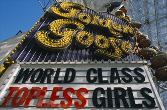 USA, Nevada, Las Vegas, Golden Goose strip joint ‘ Topless Girls ‘ sign in Fremont street covered