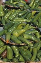 MEXICO, Oaxaca, Oaxaca City, Close view of green chillies displayed at market.