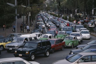 MEXICO, Mexico City, "Traffic congestion on Paseo de La Reforma, long tailback of cars and taxis."
