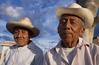 MEXICO, Yucatan, Hoctun, "Two smiling, elderly men in hats, head and shoulder portraits one