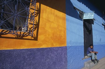 MEXICO, Chiapas, San Cristobal de Las Casas, "Part view of building painted in rectangles of ochre,