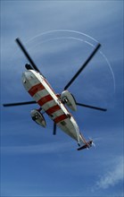 SCOTLAND, North Sea, Murchison Oil Field, "Helicopter hovering, seen from below with red and white