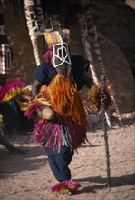 MALI, Dogon Country, Tirelli, Masked Dogon dancer performing a ritual funeral dance.