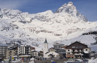 ITALY, Valle d’Aosta, Breuil Cervinia, "Ski resort town with church, hotel and petrol pumps with