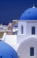 GREECE, Cyclades Islands, Santorini, Architectural detail of blue and white painted churches.