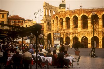 ITALY, Veneto, Verona, Piazza Bra.  Busy cafe with people eating and drinking at outside tables in