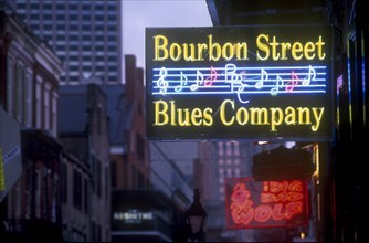 USA, Louisiana, New Orleans, Bourbon Street.  Illuminated neon street signs.