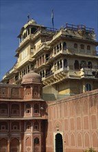 INDIA, Rajasthan, Jaipur, City Palace / Royal Palace looming over pink and white building