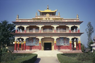 INDIA, Bihar, Bodh Gaya, Tibetan Temple facade with red columns