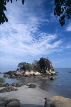MALAYSIA, Penang, Batu Ferringhi, Batu Ferringhi or Foreigners Rock rising out of shallow water