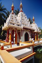 MALAYSIA, Penang, Georgetown, Dharmikarama Burmese Temple.  Exterior with ornate carved roof and