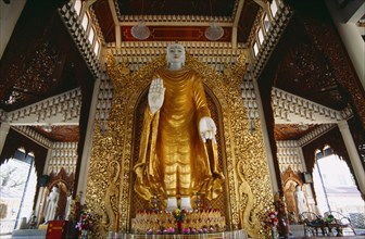 MALAYSIA, Penang, Georgetown, Dharmikarama Burmese Temple.  Interior with large standing Buddha