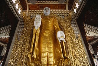 MALAYSIA, Penang, Georgetown, Dharmikarama Burmese Temple.  Interior with large standing Buddha