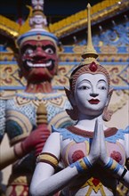 MALAYSIA, Penang, Georgetown, "Wat Chayamangkalaram.  Exterior, temple statues."