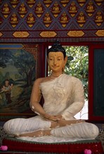 MALAYSIA, Penang, Georgetown, Wat Chayamangkalaram.  Interior with seated Buddha figure in