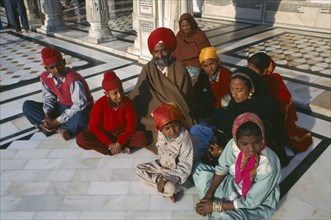 INDIA, Punjab  , Amritsar, Sikh family of pilgrims at the Golden Temple