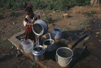 INDIA, Orissa, Gopalpur-on-Sea, Girl fetching water