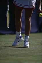 10128797 SPORT   Tennis  Gabriel Sabatini competing at Wimbledon. View of lower body preparing to serve