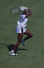 10128798 SPORT  Ball Games Tennis  Venus Williams on court taking shot.