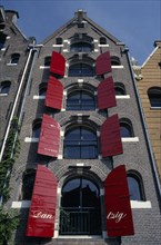 HOLLAND, North, Amsterdam, Brauwers Gracht. Tall building with red shutters
